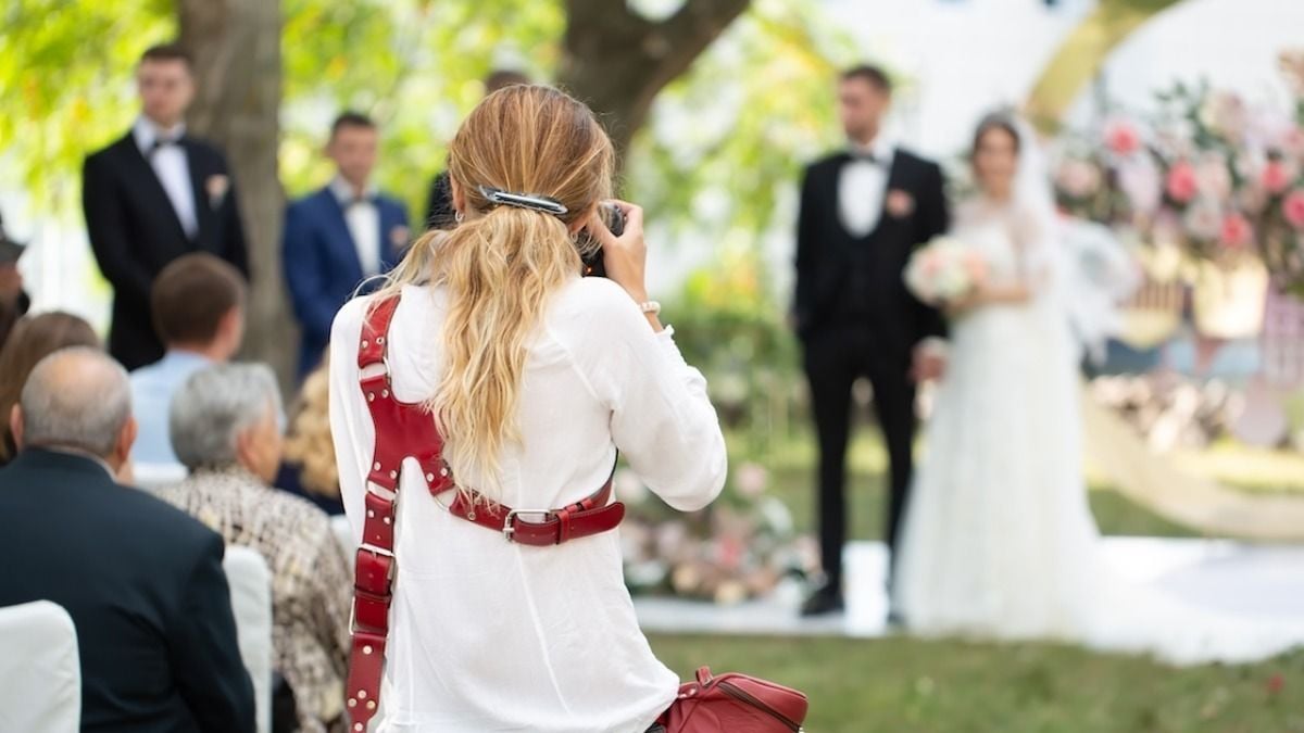 Photographer asks wedding guest to leave, 'stay out of my way.' 'I am family.' AITA?