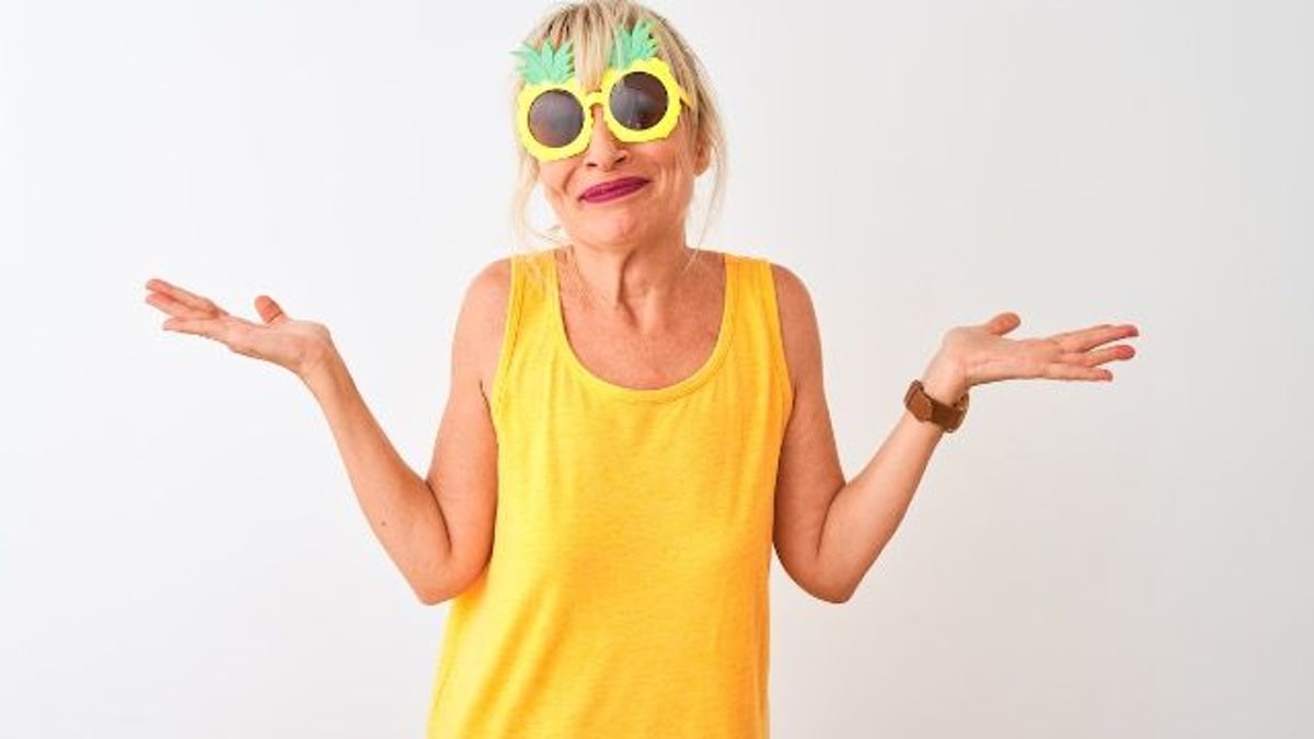 Woman 'ruins' joint vacation when she greets friend, husband and kids topless. AITA?