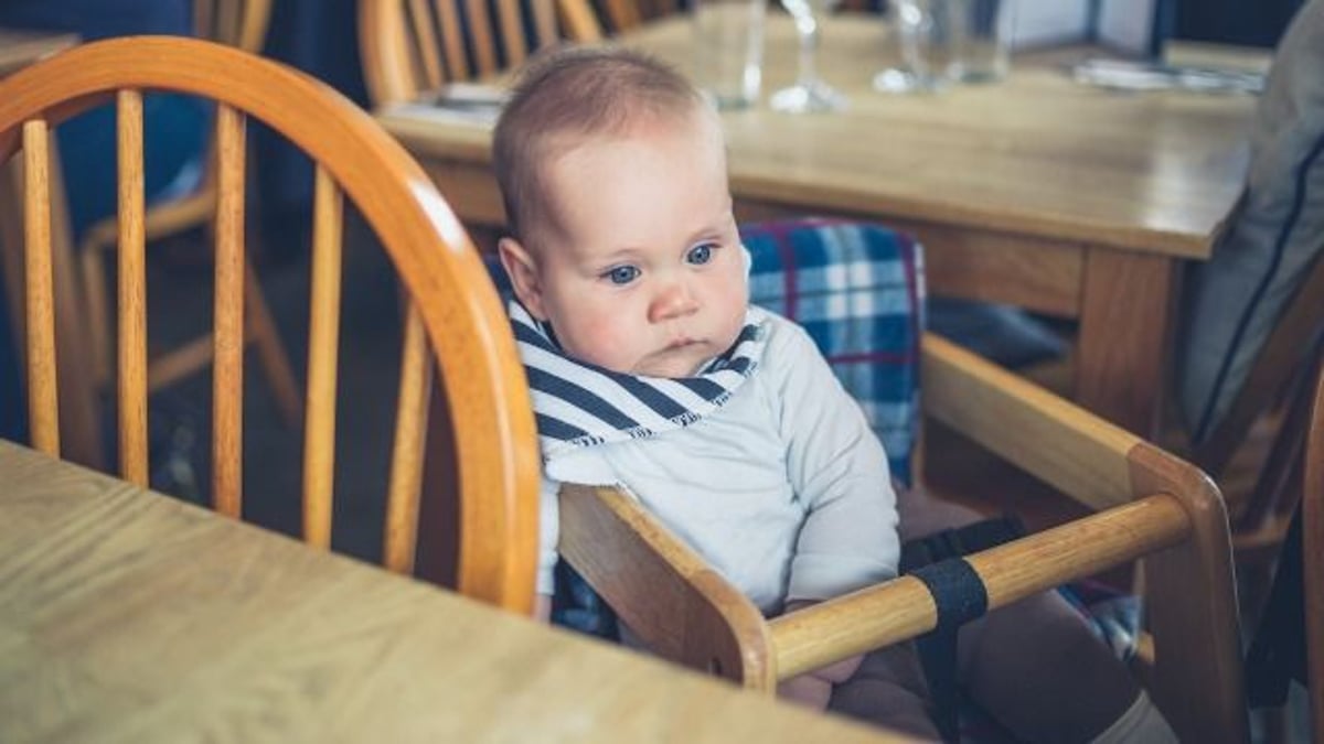 Dad asks if he was wrong to make baby 'laugh' in restaurant on wife's birthday.