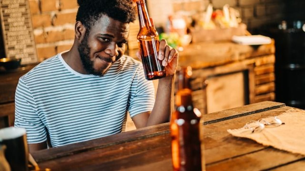 Man goes in wrong door for wife's coworker's funeral, chugs beer, she gets upset at him.