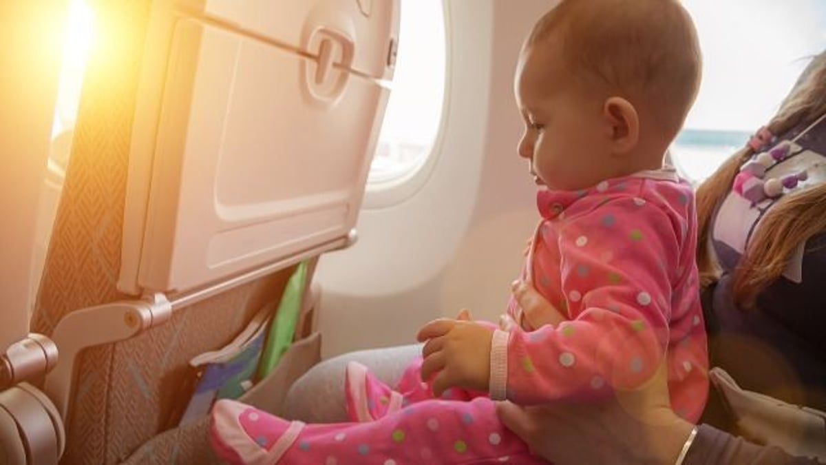 'AITA for making a woman move because my kid was kicking her seat on the plane?'