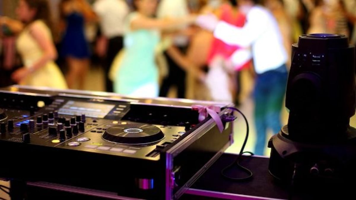 Wedding DJ interrupts proposal on the dance floor, 'it's not appropriate;' AITA?