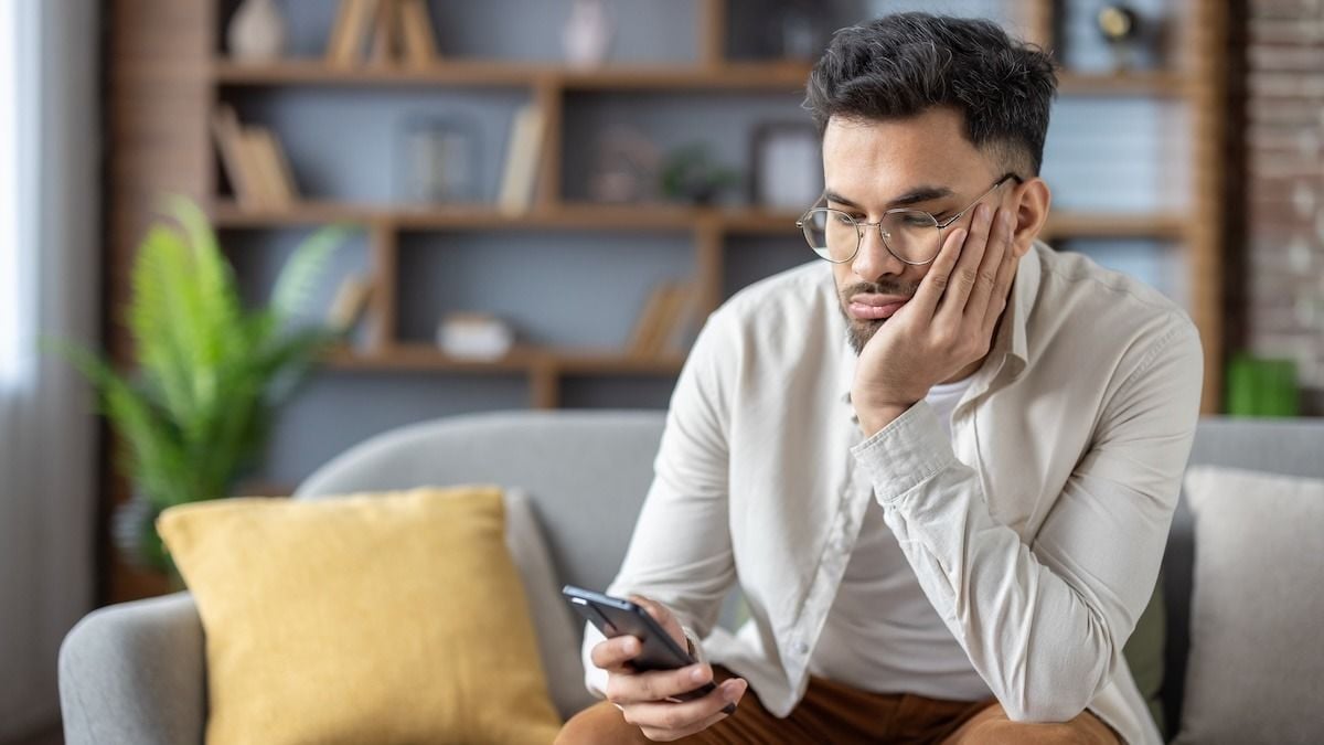 Man tired of his own happiness 'triggering' his friend's depression; 'everyone is happy but him'. AITA?