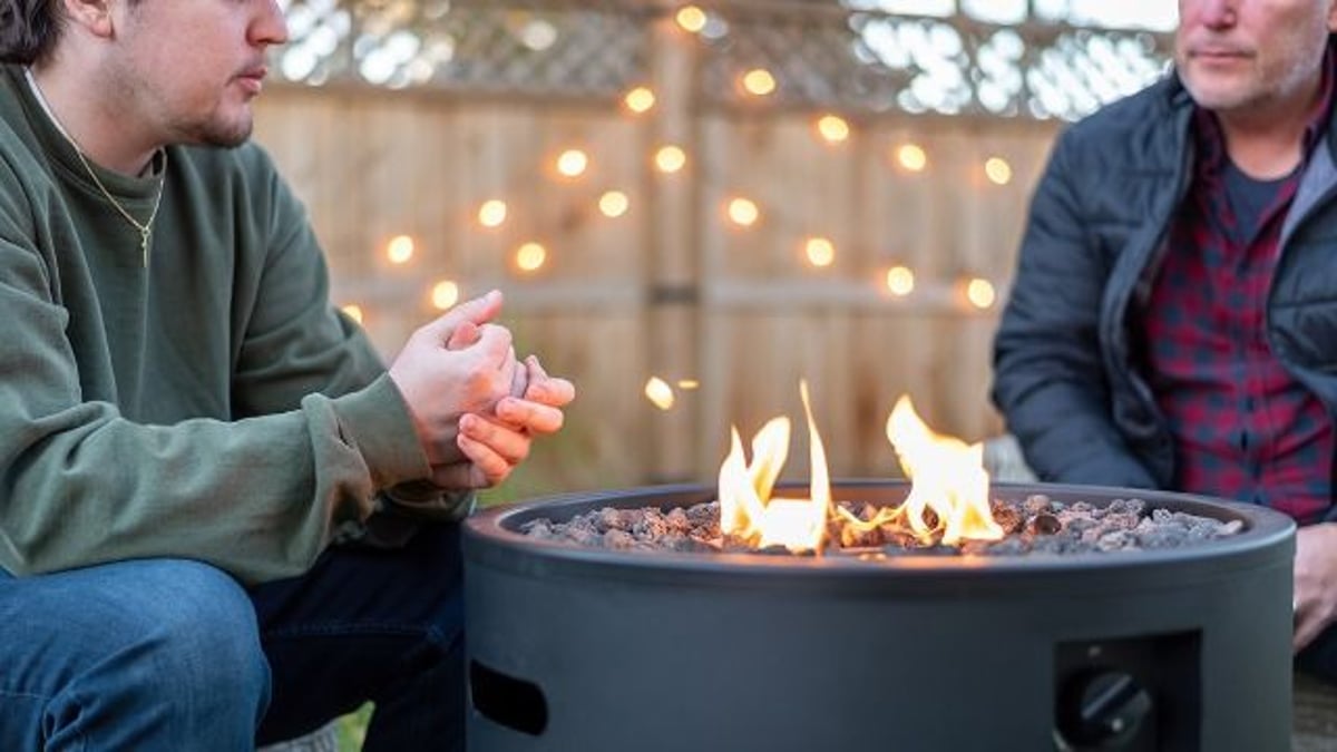 Woman puts out neighbor's fire with hose; says 'there's a fire ban.' He threatens cops.