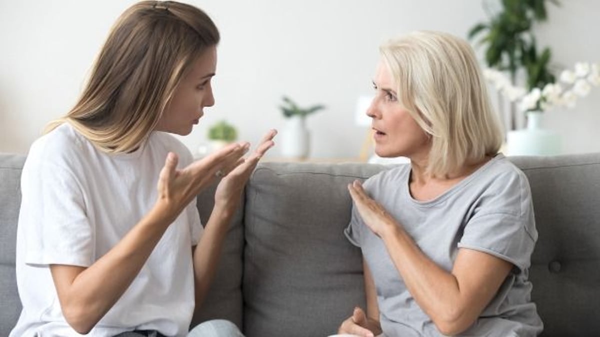 Woman threatens to skip family vacation if widowed mom brings new boyfriend along.