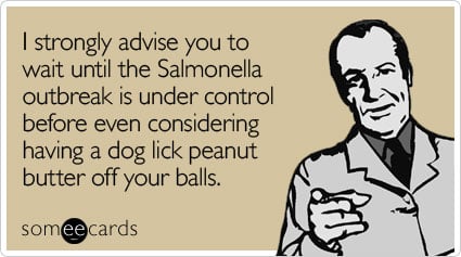 I strongly advise you to wait until the Salmonella outbreak is under control before even considering having a dog lick peanut butter off your balls